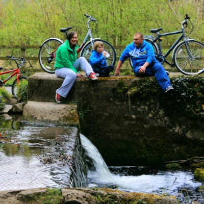 family on bridge during cycling tour kilkenny