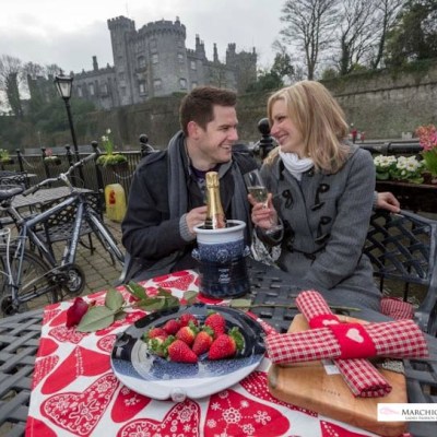 couple having strawberries & champagne in kilkenny