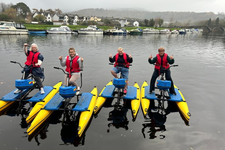 a group of people on a boat in the water