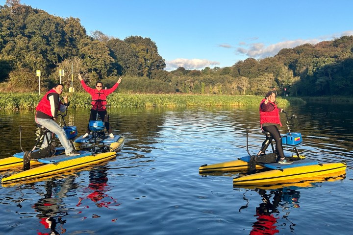 a group of people riding skis on a lake