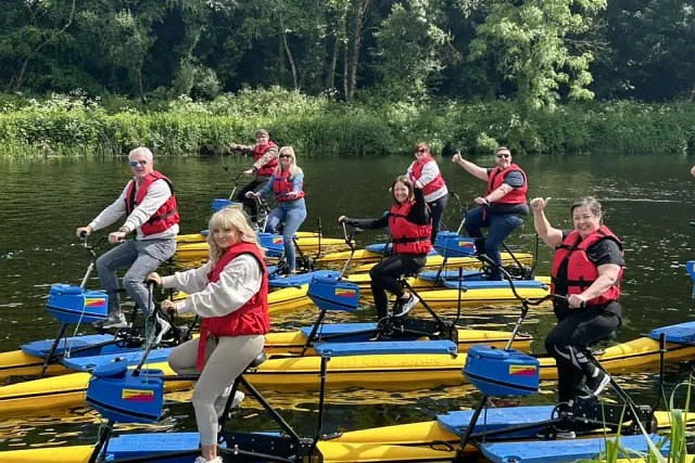 Tour Group of people enjoying activity on water bikes on River Barrow